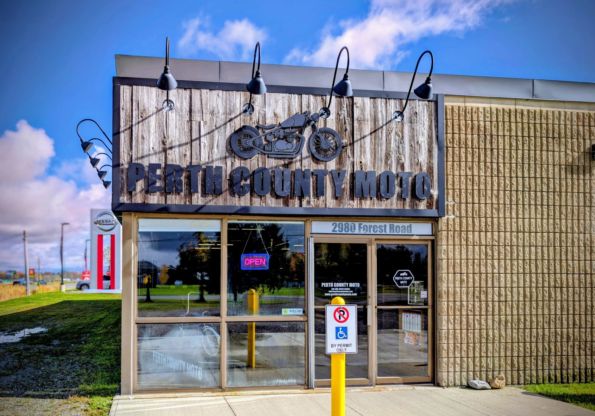 Perth County Moto building with sign and entrance on a clear day